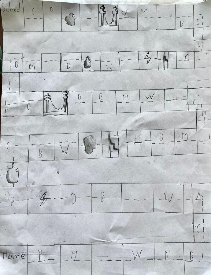 The first hand-drawn sketch of the game board on paper
